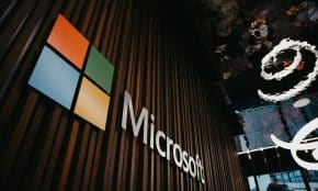 Interior view of Microsoft office with logo on wooden wall in Brussels, Belgium.