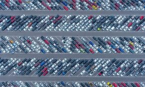 High-angle aerial photo showcasing a crowded parking lot filled with diverse vehicles in Florida.