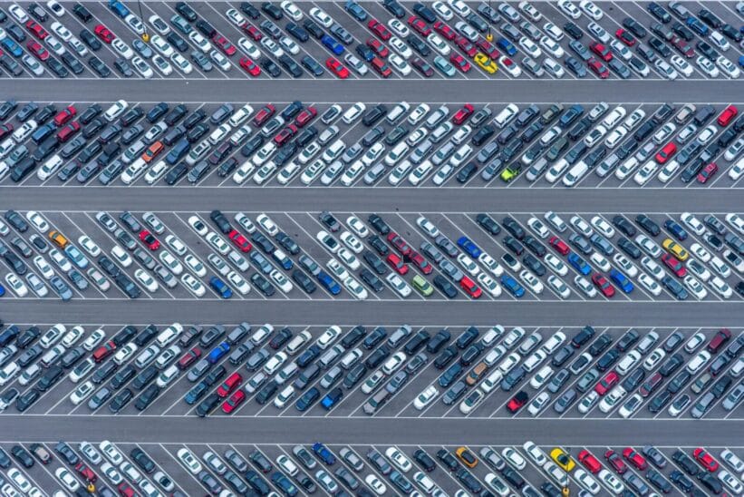 High-angle aerial photo showcasing a crowded parking lot filled with diverse vehicles in Florida.