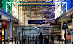 A traveler enters the security checkpoint at O'Hare Airport terminal, Chicago.