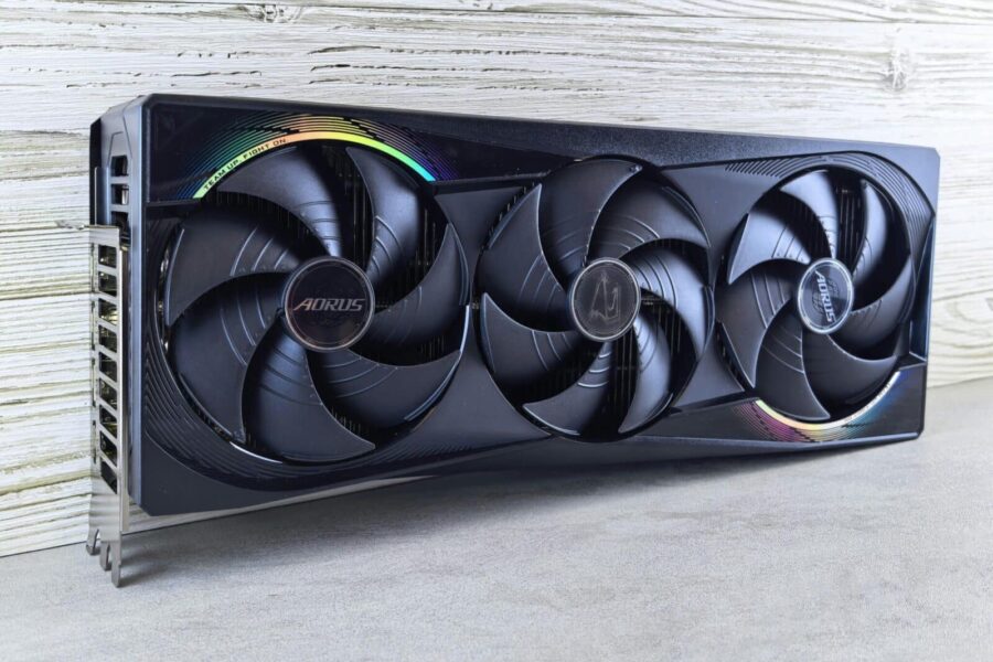Triple fan GPU with RGB lighting, ideal for gaming setups and high-performance computing.