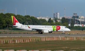 Embraer E190 airliner taxiing at Manises Airport in Valencia, Spain.
