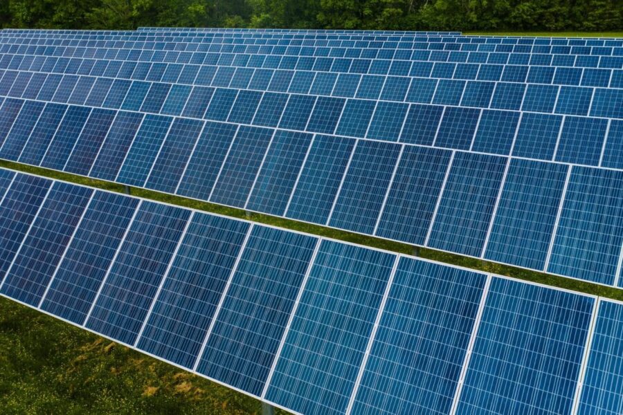 A vibrant solar farm showcasing rows of photovoltaic panels capturing energy.