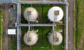 Drone aerial view of industrial silos and pipelines in Banten, Indonesia.