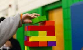 person piling blocks