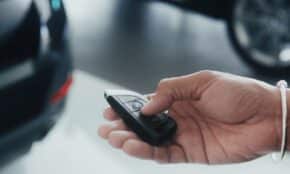 a person holding a cell phone in their hand