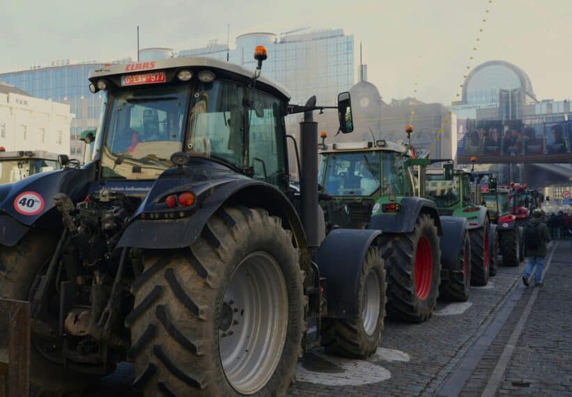 a row of tractors parked next to each other