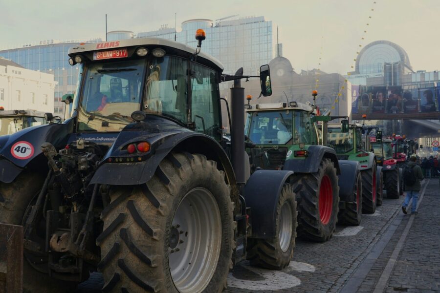 a row of tractors parked next to each other