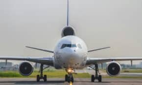 a large jetliner sitting on top of an airport runway