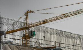 Construction crane against a cloudy sky