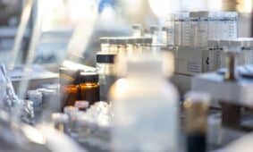bottles of medicine are lined up on a table